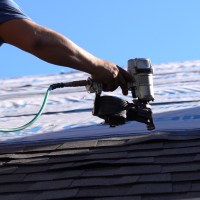 Nail Gun Repairing a roofing leak